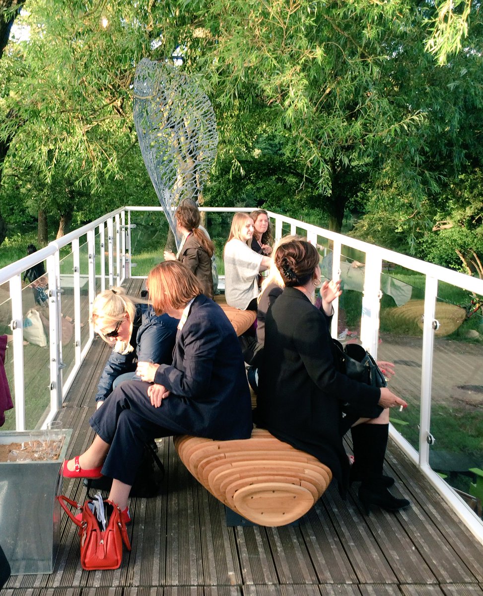 People enjoying the benches at#AAFHampstead #art