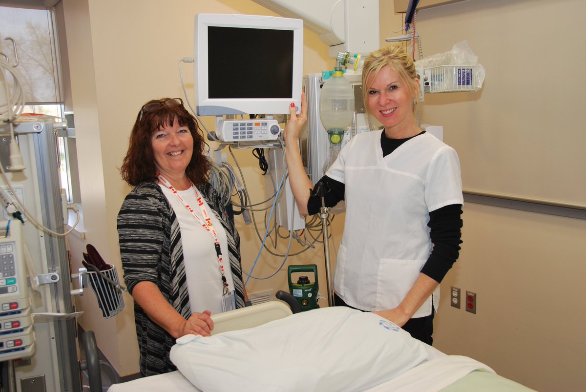 RNs Jane Moore & Karen Wilson give thanks to donors for cardiac monitor, bariatric bed & airmattresses for ICU