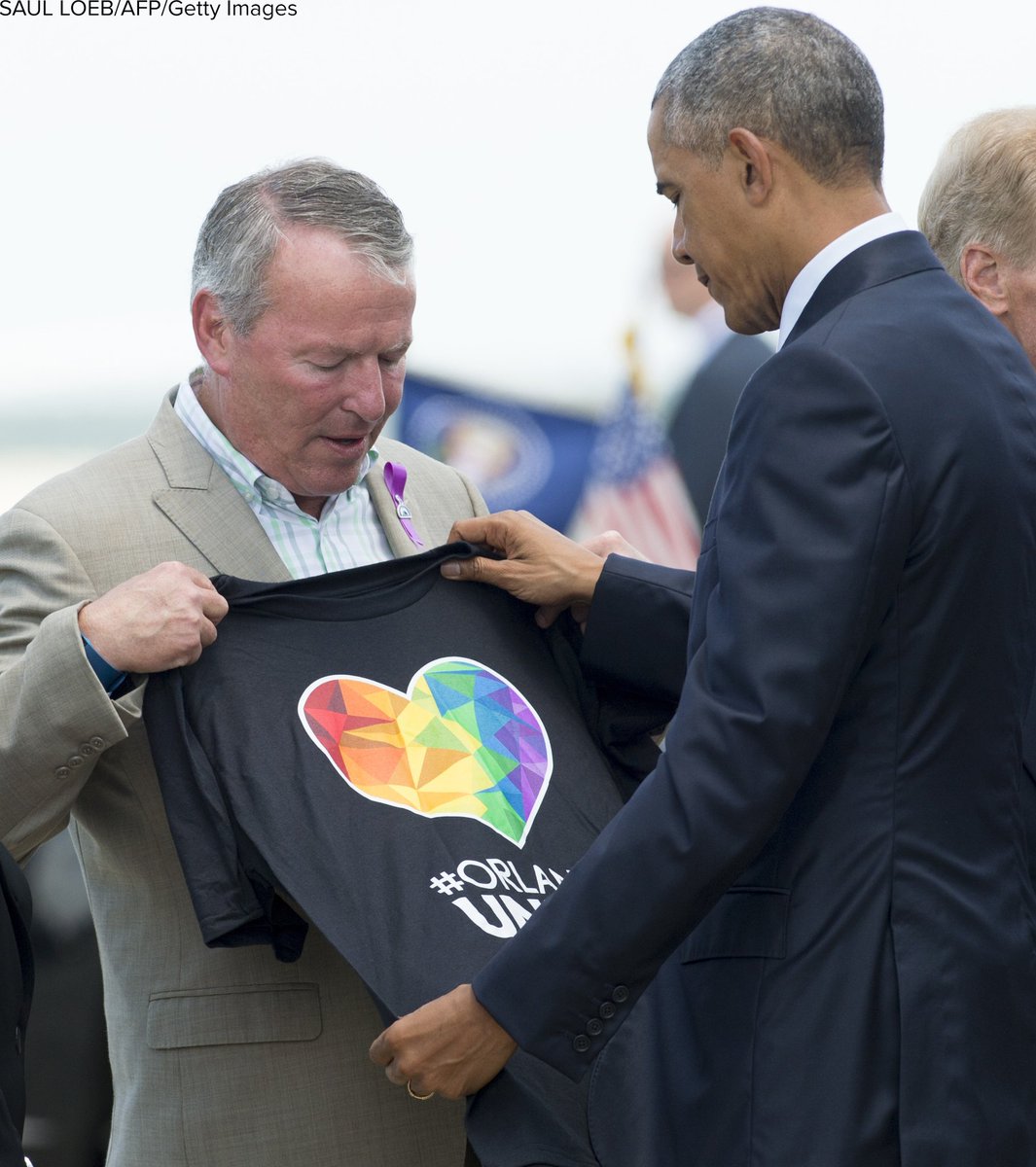 GMA's tweet photo. Orlando mayor hands @POTUS Obama an #OrlandoUnited shirt while greeting him at airport: https://t.co/RtJmJP4RuQ https://t.co/3KhnRdtATT