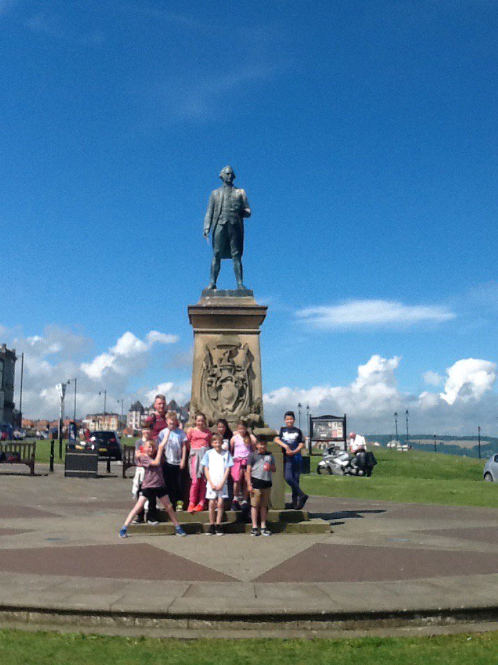 HCPSHawks's tweet photo. Day 2 - Whitby! Captain Cook's statue! Glorious day of sunshine! ☀️ https://t.co/vni6FmQu2f