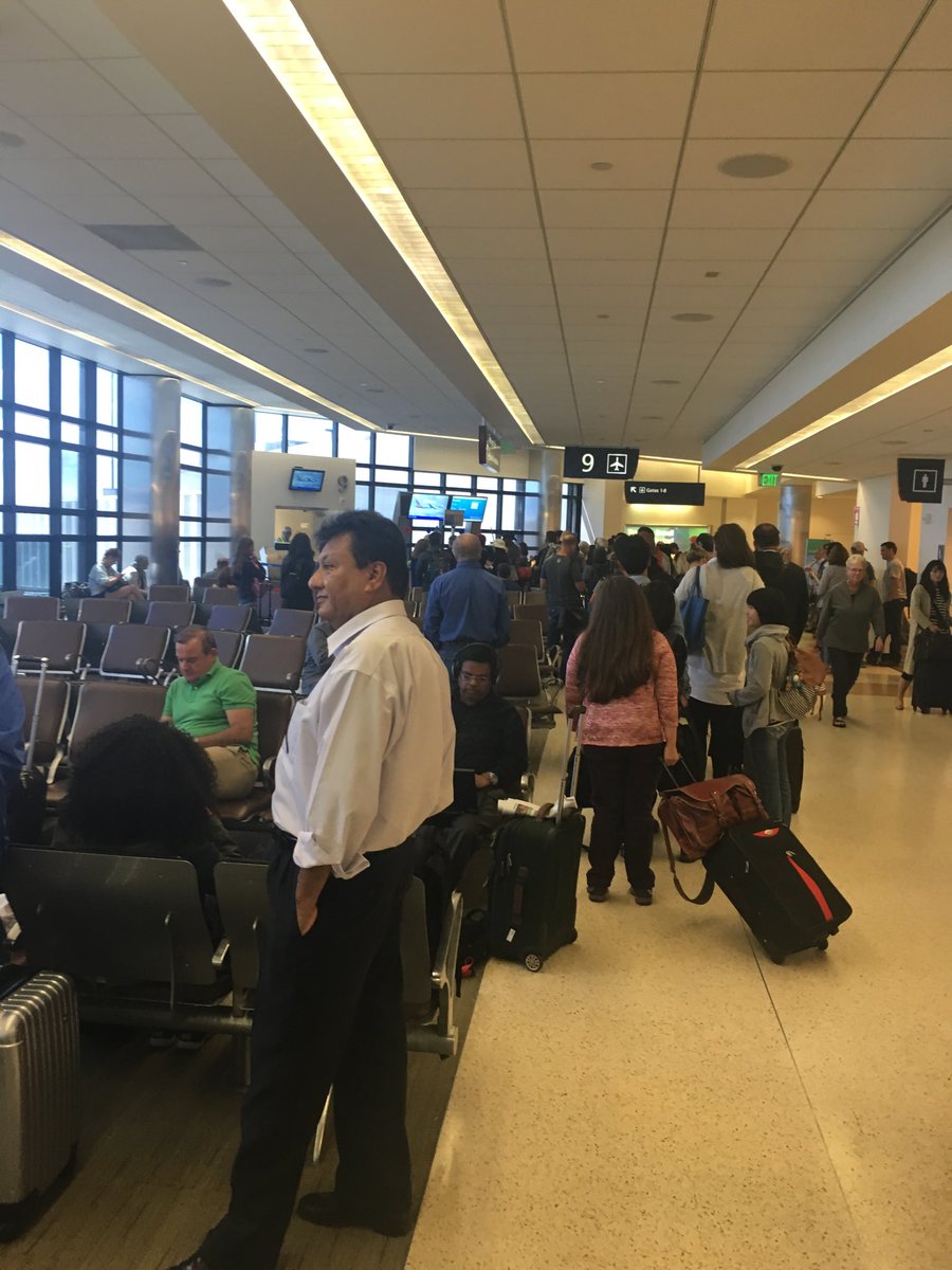 sonniebry's tweet photo. @AmericanAir 50 people still waiting to get boarding passes for flight 1597 that leaves in 10 minutes.  Come on AA https://t.co/rIFT6A0wF1