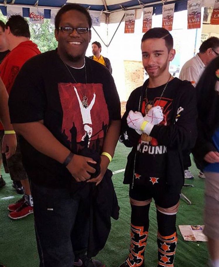 Little_CM_Punk's tweet photo. Little Cm Punk with a fan. #martincountyfair https://t.co/jM1q1FSMbg