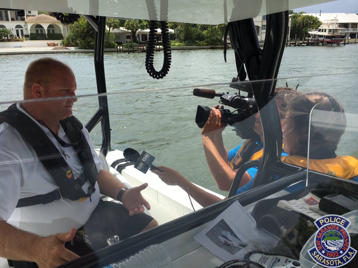 SarasotaPD's tweet photo. .@BeBo_Here &amp; @lynblake of @SNNTV speaking to Ofc Schwenk about protecting your boat from thefts! Story airs at 5. https://t.co/Y7v13Wswh1
