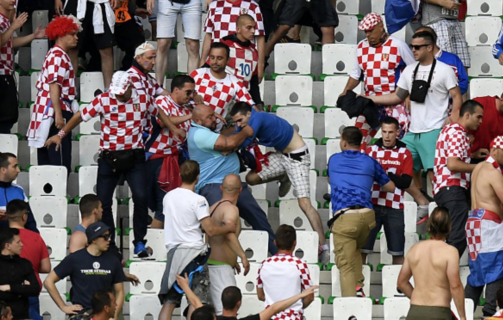 *Croatian fans (left) having fight with hooligans, mostly younger people certainly under alchocol effect or drugs.*