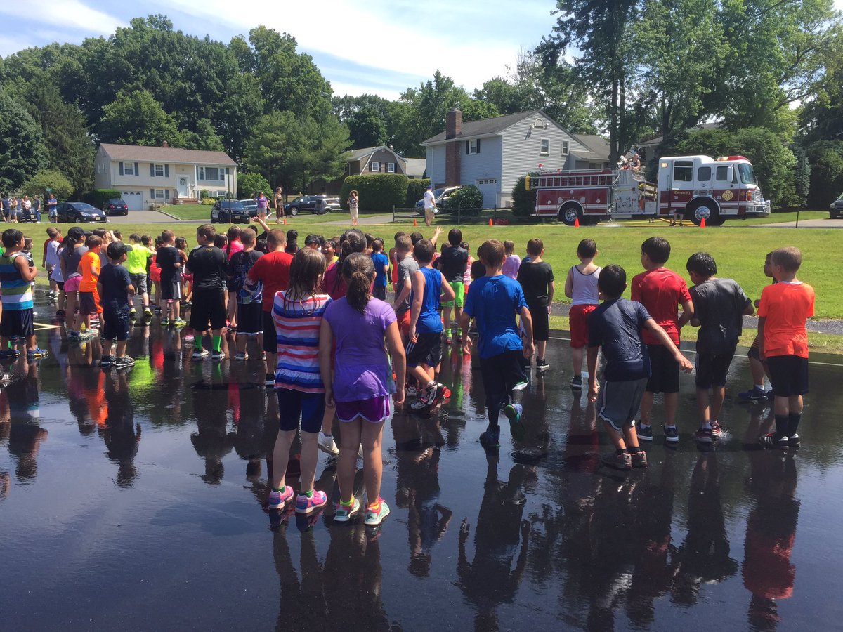 KristyFriedman's tweet photo. The 1st &amp; 2nd graders enjoyed the wet down today. No place was safe from your aim! Ty @emersonnjfire @Principaljess https://t.co/J8Bh1dLgWe