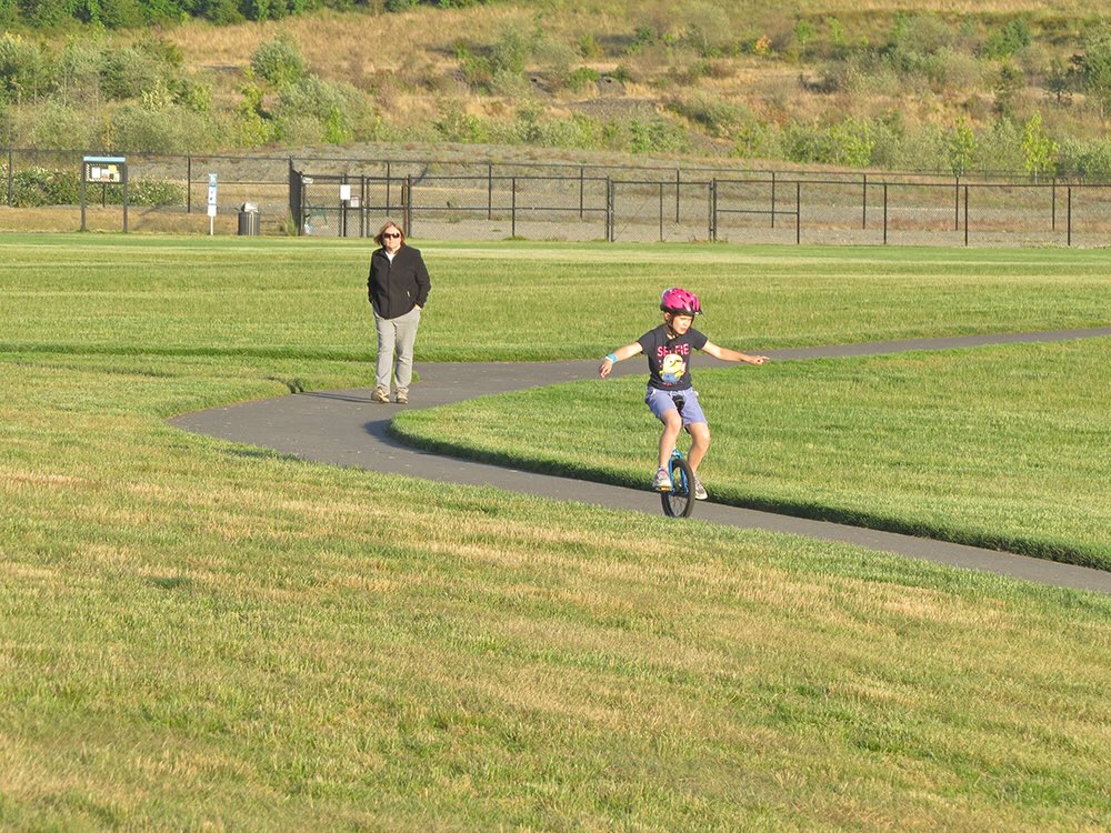 Unicycling at #ChambersBay a year after #USOpen2015 - fun for our girl! #unicycle