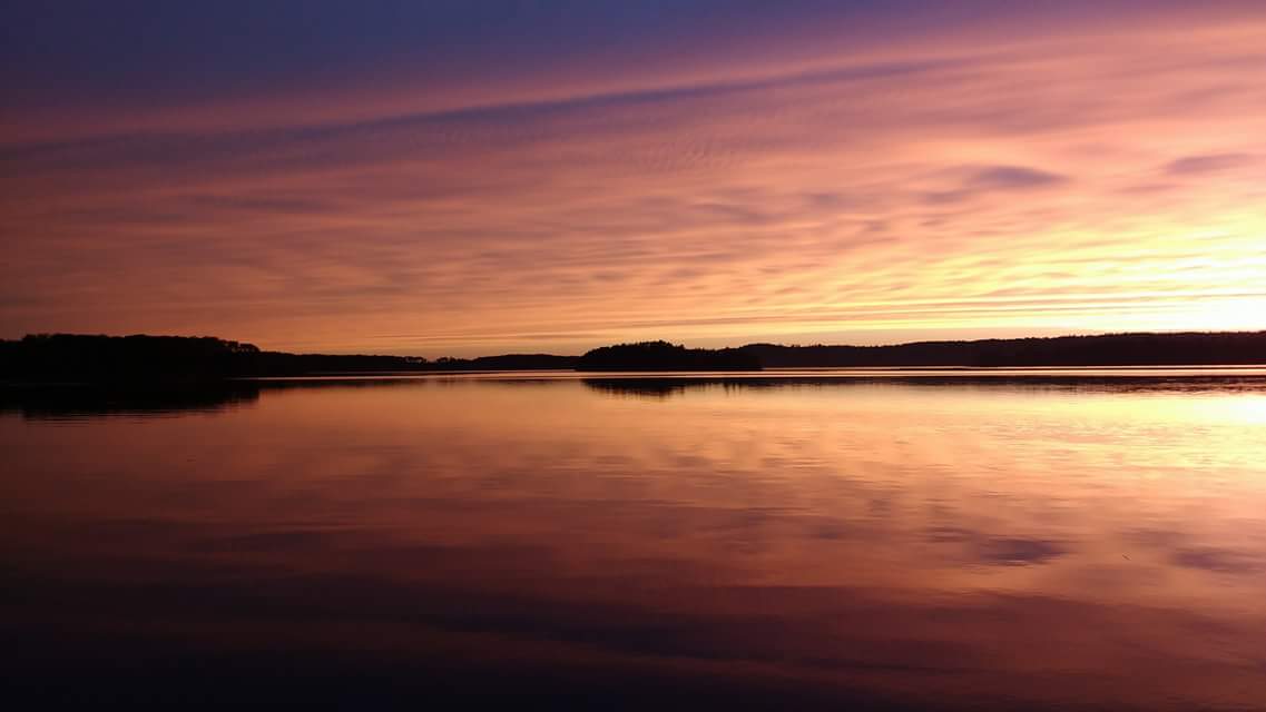Northern_Tier's tweet photo. Kyle took this great picture of the sunset on Perch Lake at the Atikokan base #getswamped2016 #holry https://t.co/9PCB2sf5lQ