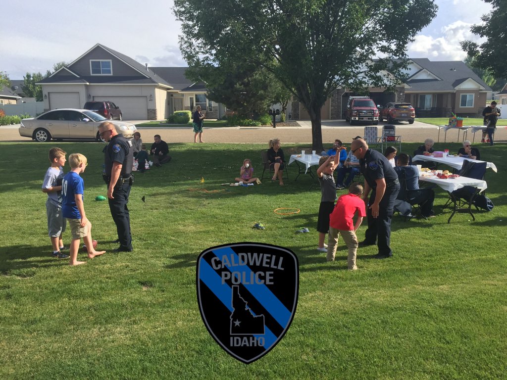ChiefWyantPD's tweet photo. Sgt Sloan and Cpt Riley out at a neighborhood watch block party 3on3 football with the kids https://t.co/rk5gYuazGI