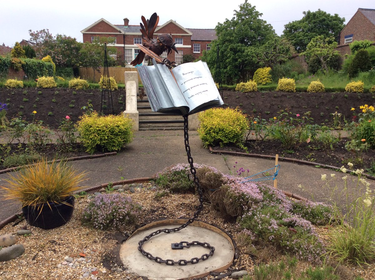 GraculusSculpt's tweet photo. 'ROOKWORM' commission installed! #sculpture #bookworm #garden #books #scriptorium #library #archive #medieval https://t.co/X1HSLqTy7v