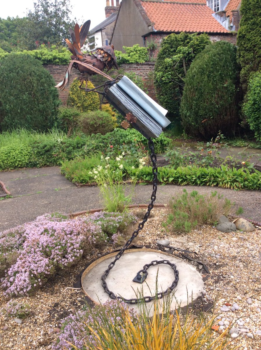 GraculusSculpt's tweet photo. 'ROOKWORM' commission installed! #sculpture #bookworm #garden #books #scriptorium #library #archive #medieval https://t.co/X1HSLqTy7v
