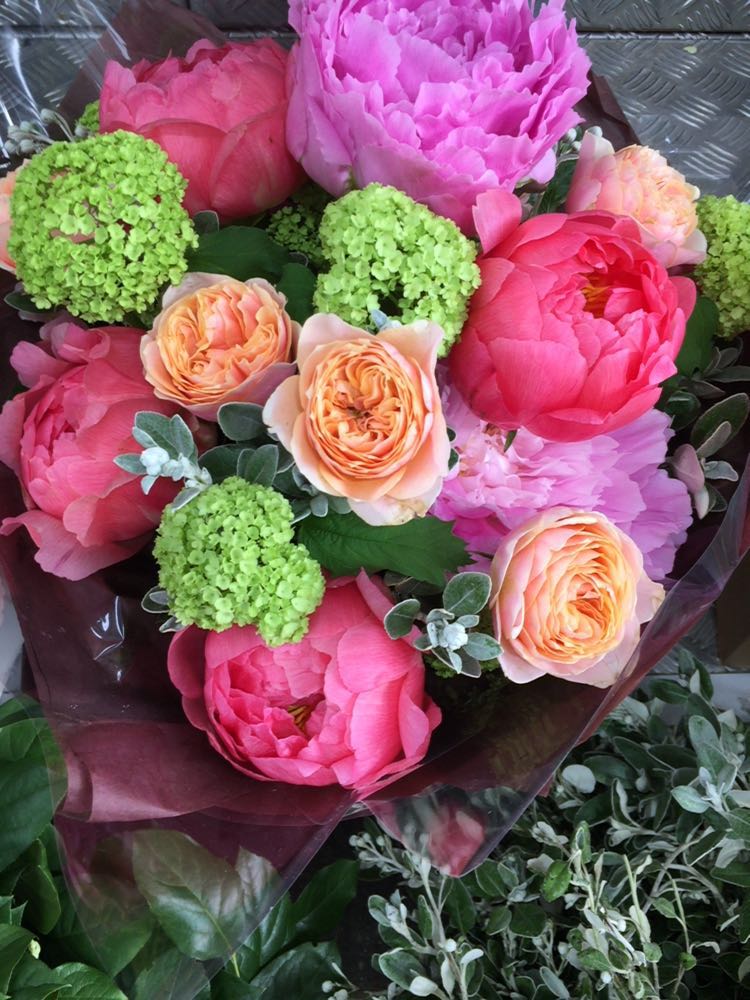 Paeonies, Viburnum and Vuvuzela Roses. Hand Tied by one of our very talented designers.