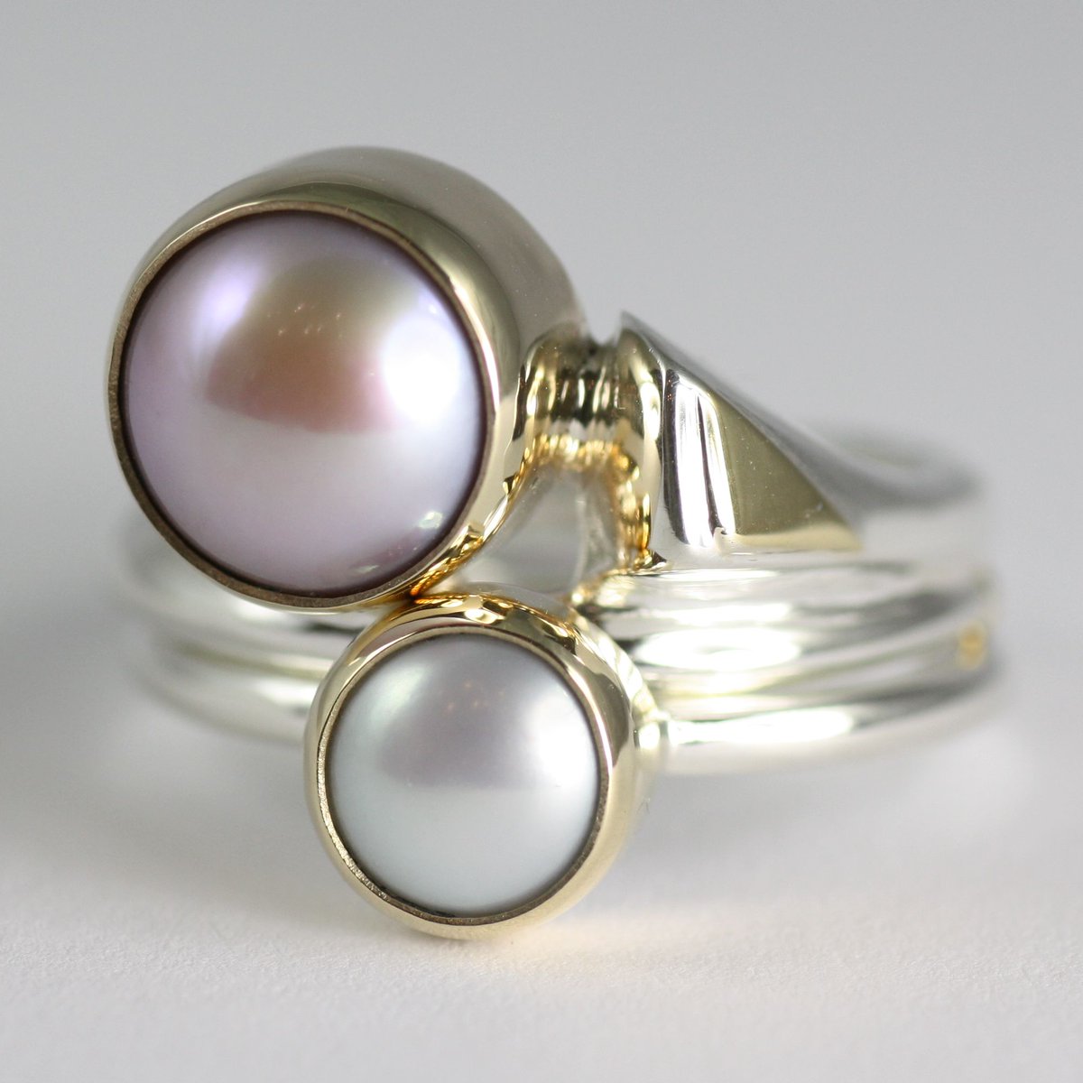 LeighFothJewel's tweet photo. Pair of silver, gold and pearl rings #junebirthstone #pearls #stackingrings #pearlrings #finejewellery #luxury https://t.co/01vs2z99DI