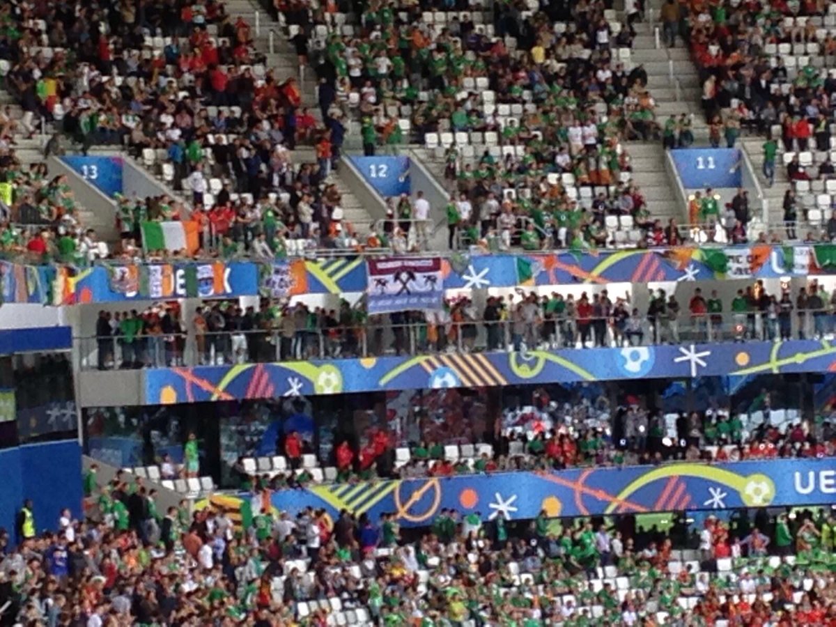 westhamfootball's tweet photo. Hawaiian Hammers flag out again at the Ireland v Belgium Euro 2016 game https://t.co/fqgLEk1hxd