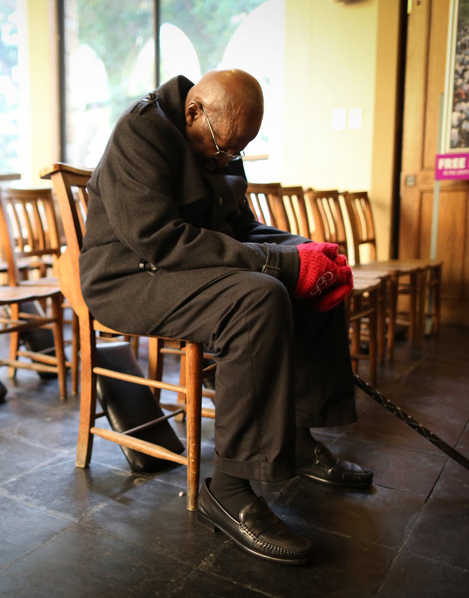 DesmondTutuPF's tweet photo. Archbishop Tutu prays during  vigil at St. George's Cathedral for victims of the Orlando massacre. #OrlandoUnited https://t.co/YiA6AtJHBY