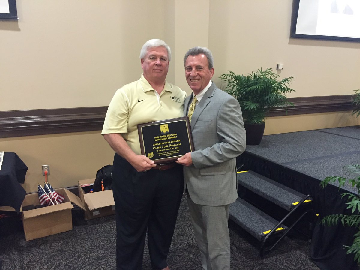 daveeas's tweet photo. Coach Scott Ferguson receiving #SCHSSCA Hall of Fame award from Coach Dick Smith at the North South banquet #16NSSC https://t.co/3Hg5sAk1lA