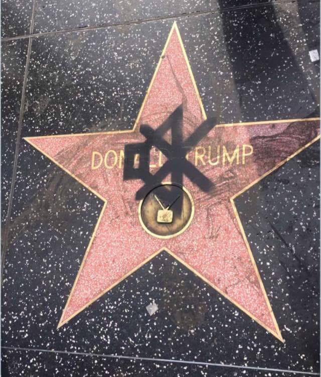 WORLDSTAR's tweet photo. Someone spray painted the mute sign over Donald Trump's star https://t.co/NLbYXliZk7