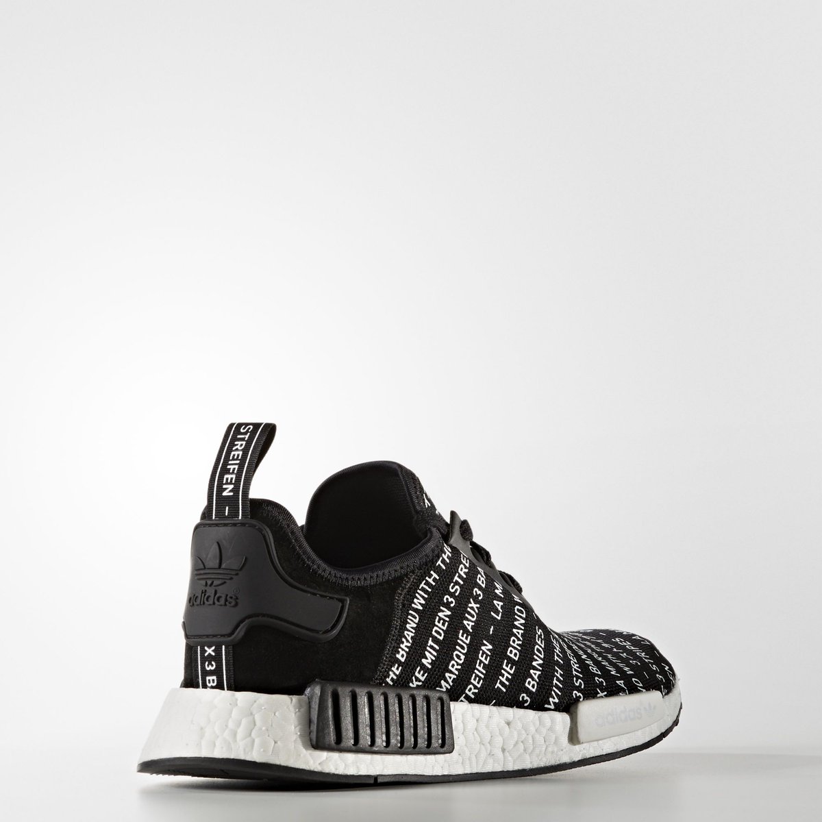 nmd black with white writing