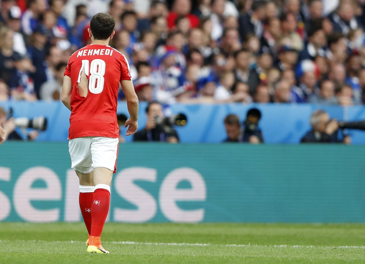 STsportsdesk's tweet photo. #FRA were on a tear today. FOUR ripped shirts for #SUI. Xhaka x2, Mehmedi, Embolo. #fournil #SUIFRA #EURO2016 https://t.co/5shT2GZQsb