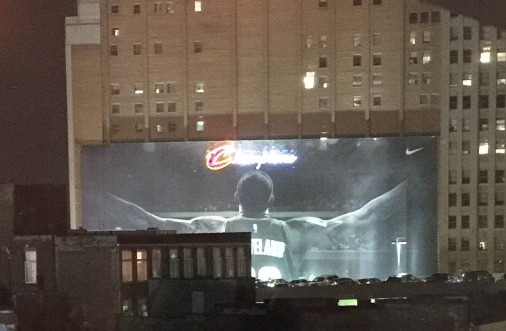 darrenrovell's tweet photo. LeBron's Nike banner in Cleveland now says "CHAMPIONS" above him (Credit: @amazingtickets) https://t.co/bvj4S93MUo