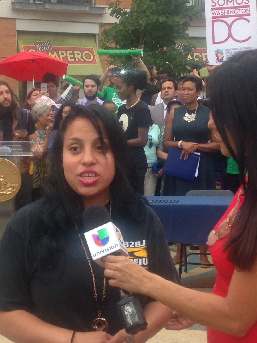 32BJSEIU's tweet photo. 32BJ janitor Michelle Rios tells @UniNoticias: @MayorBowser's (directly behind) $15 min wage will help her 2 kids. https://t.co/YMzgMWB2DA