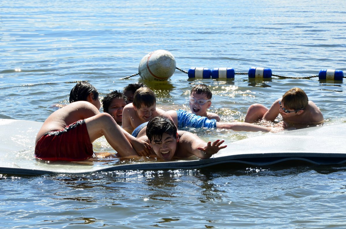 OLSONYMCA's tweet photo. Hennepin cabin is spending the #FirstDayOfSummer playing on the water mat. How are you celebrating? #campolson https://t.co/5xVm8R48NZ