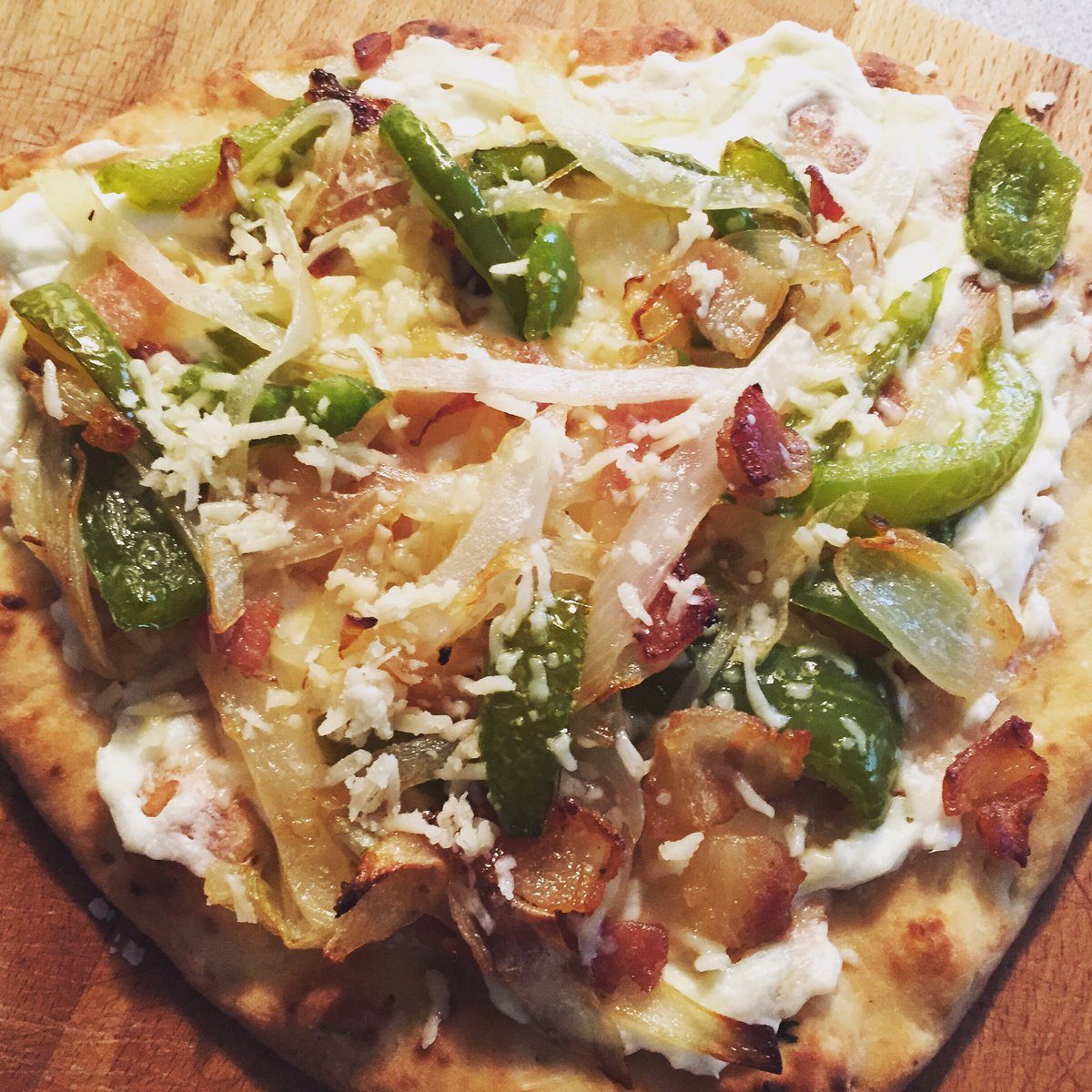uneditedfoodie's tweet photo. Tarte Flambee Alsatian served on a naan bread #comoeats #comofood #comocooks #comobakes @nightlifecomo https://t.co/SsXp7SXt2r