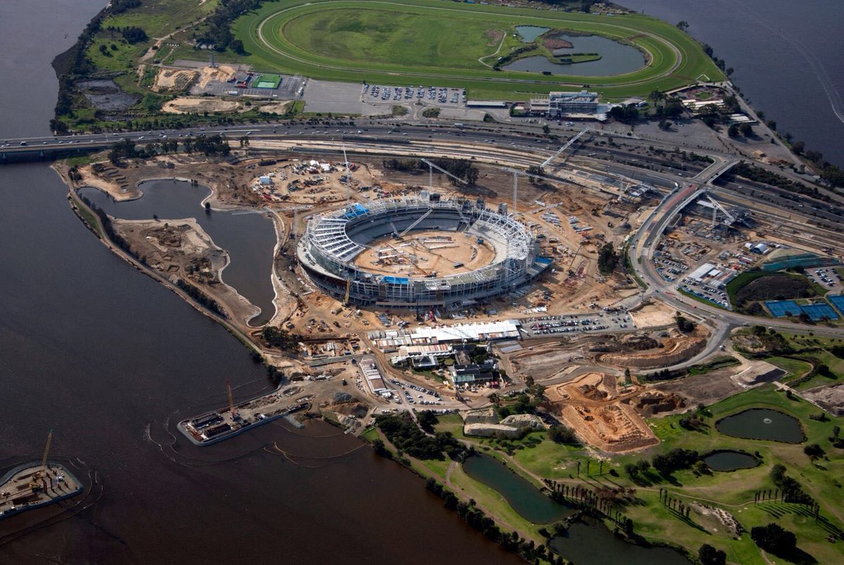 OptusStadium's tweet photo. June aerial photo is in – Bridge, Train &amp; Bus Station, Stadium, Sports Precinct…the site is alive with construction! https://t.co/UZxkRDmP4J