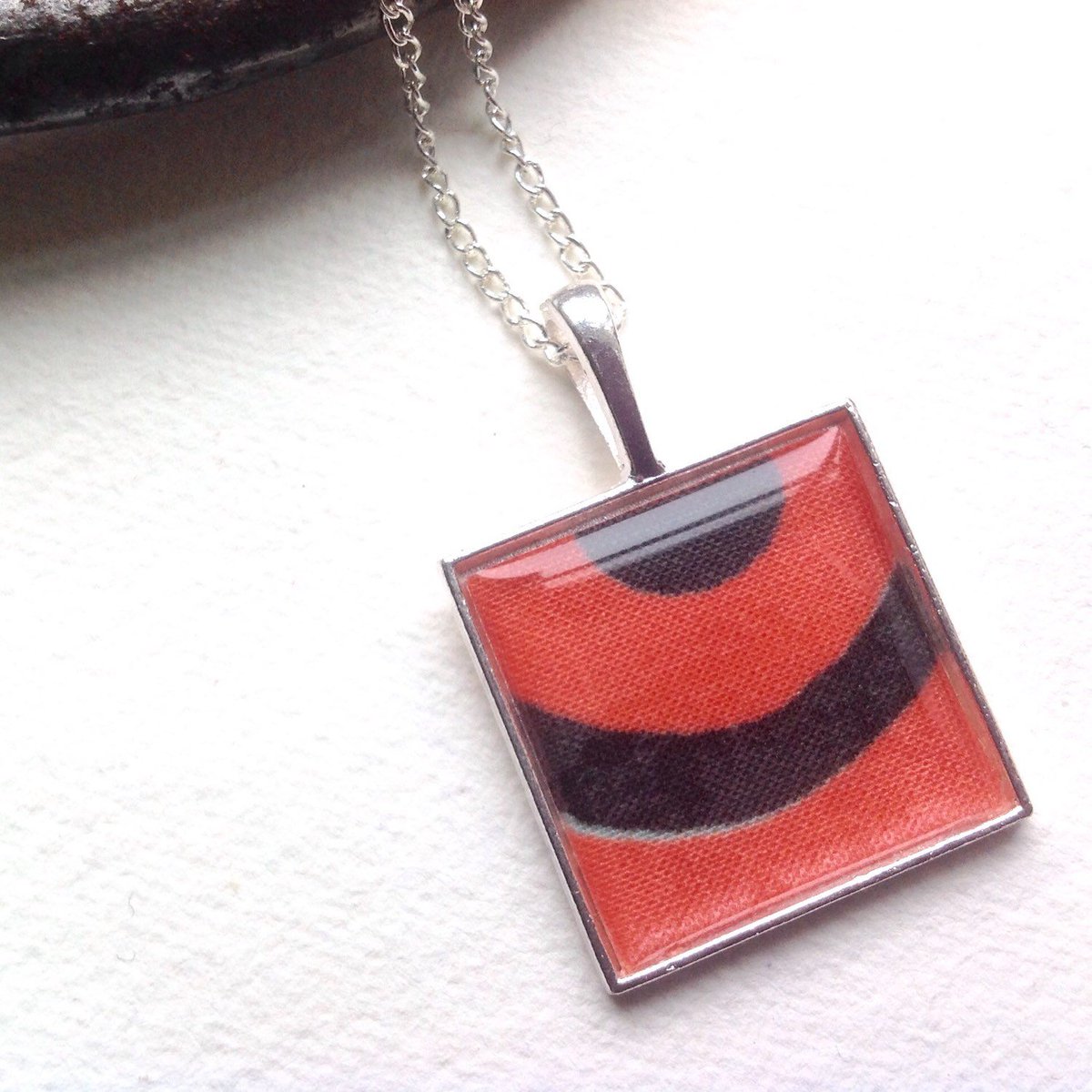 buck_lj's tweet photo. Sale Statement Necklace ~ Retro Orange Black Print Fabric Pendant, Bold J⦠https://t.co/XoWcO8GQWM #Etsy #ModernGift https://t.co/hvxhrXOhal
