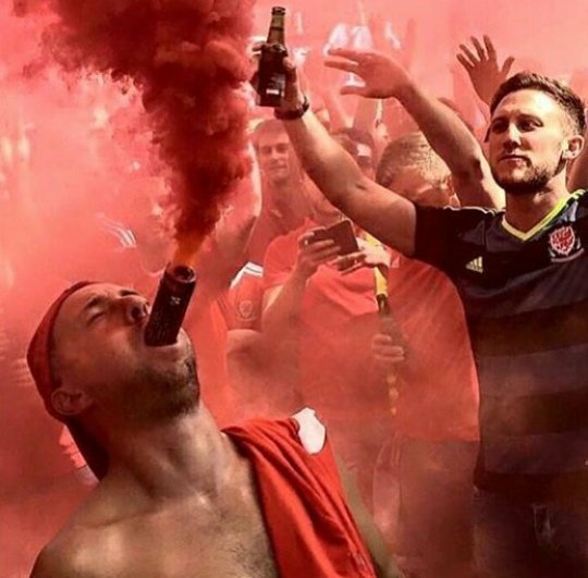 Wales fans yesterday with some pyro, and beer of course. #Antiuefamafia