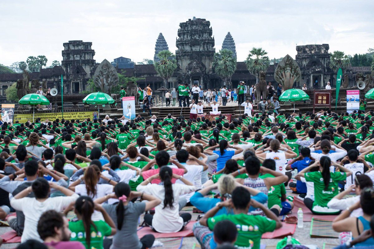 MEAIndia's tweet photo. An ancient discipline strengthens old bonds. #YogaDay celebrations at the iconic Angkor Wat temple in Cambodia https://t.co/qEZwVxSRY1