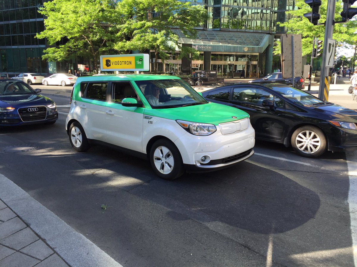 AutoblogEVs's tweet photo. Looks like #Montreal was a good place to hold @EVSymposium29 this year. Spotted on the way in: some in-use work EVs. https://t.co/Npg6RBt9x8