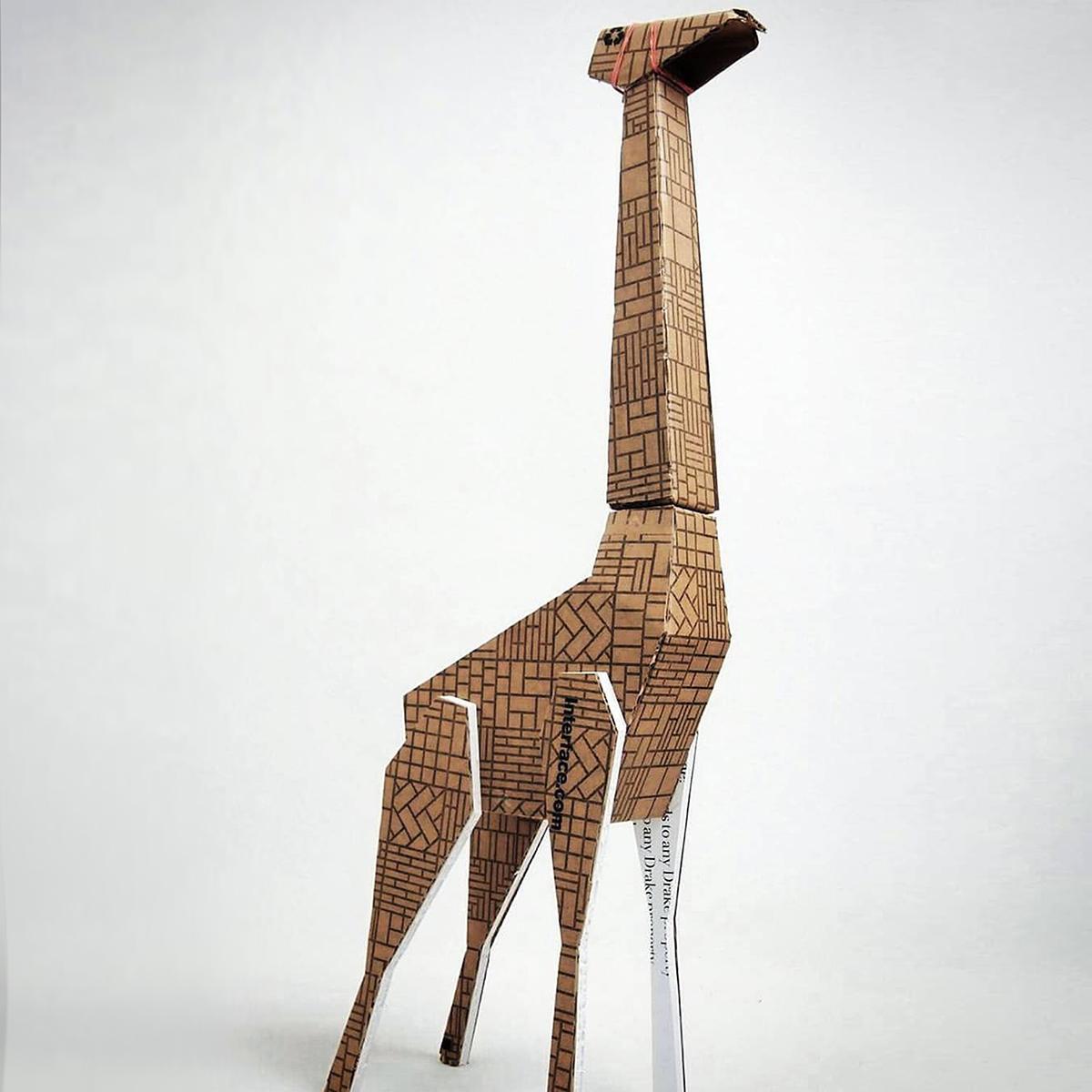 InterfaceInc's tweet photo. Celebrating #WorldGiraffeDay with a giraffe built out of our sample boxes. Credit: G. Cheng @Save_Giraffe #wgd2016 https://t.co/RNIlImm7xo
