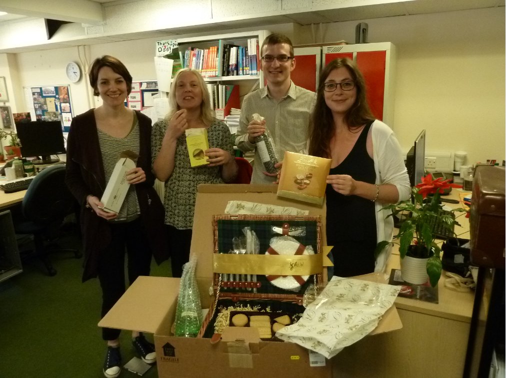 UniGlosLib's tweet photo. Julie and colleagues at Park celebrate the arrival of the @LexisNexisUK Newsdesk hamper from #biall2016 #thankyou https://t.co/kpw6mlJZK1