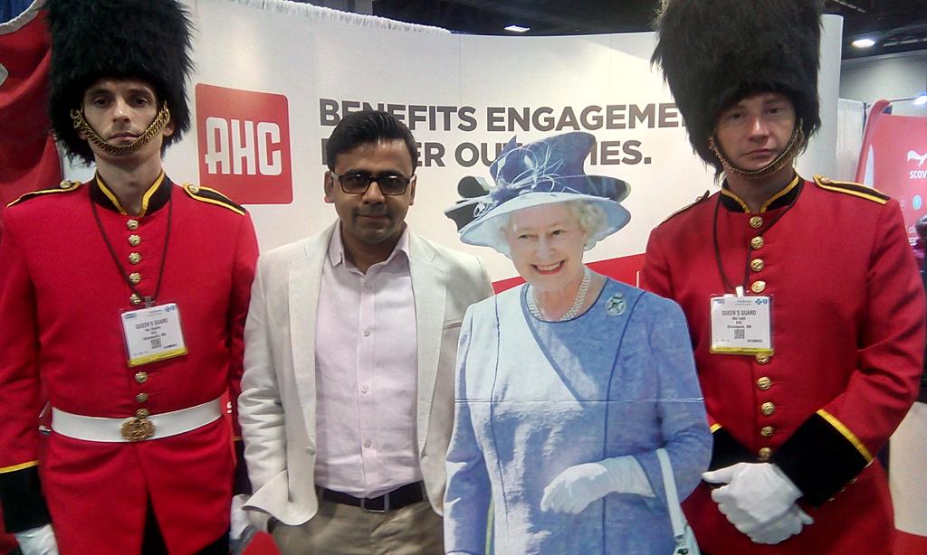 RohanMoktali's tweet photo. @ahc_global #royalcomms Posing with the Queen. Royal moment! Great message...Fabulous communication tool https://t.co/tuyXXuHBYK