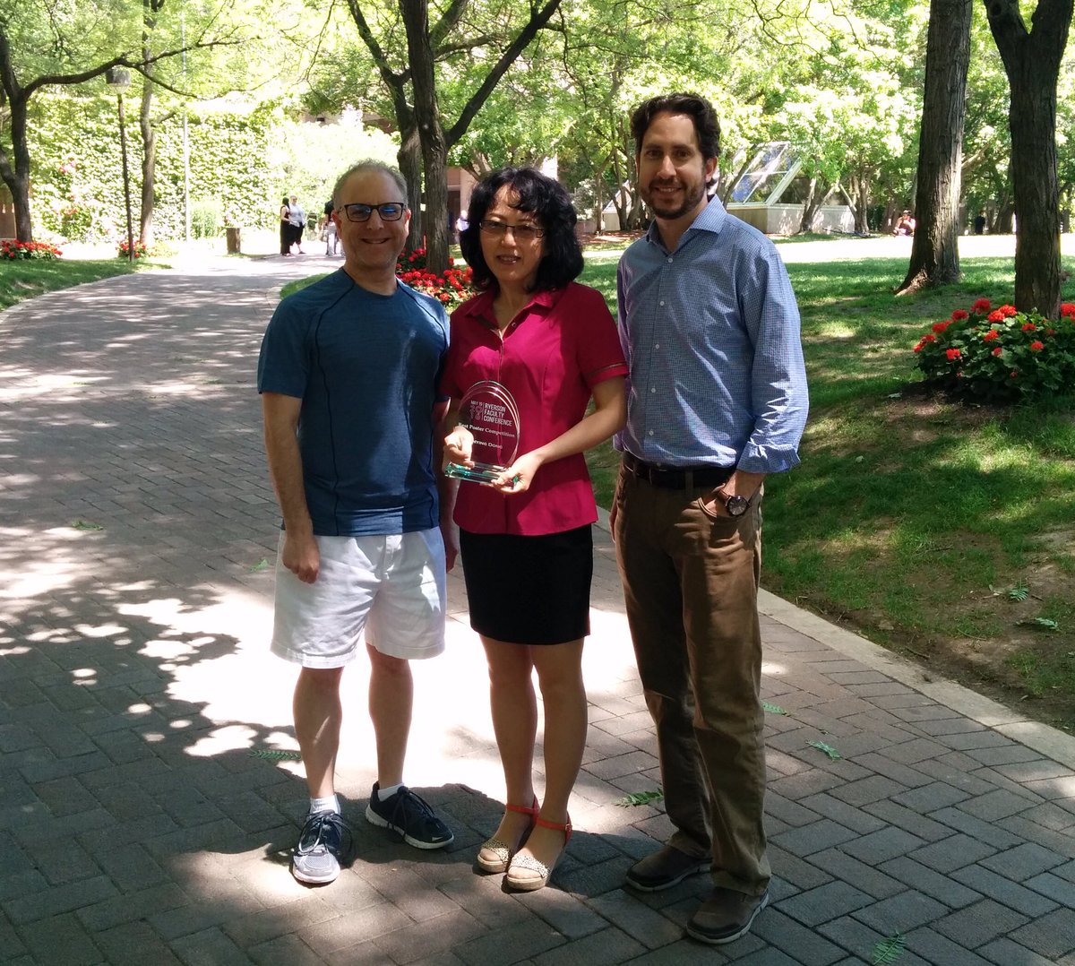 TMUTeaching's tweet photo. Linying Dong from @TRSMRyersonU receives #ryecon2016 prize for Best Poster w/ @drerickam & @CurtisMaloley #Congrats https://t.co/eNgjbClVAq