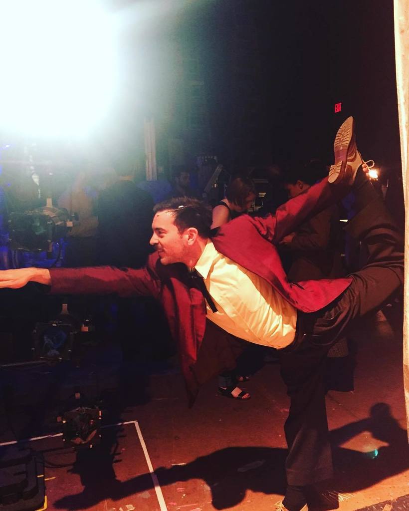 OlneyTheatre's tweet photo. @jonnyeliot (Augustin Migaldi) is celebrating #nationalyogaday with a little #standingpullingbowpose backstage #otc… https://t.co/LKmWmF8Yss