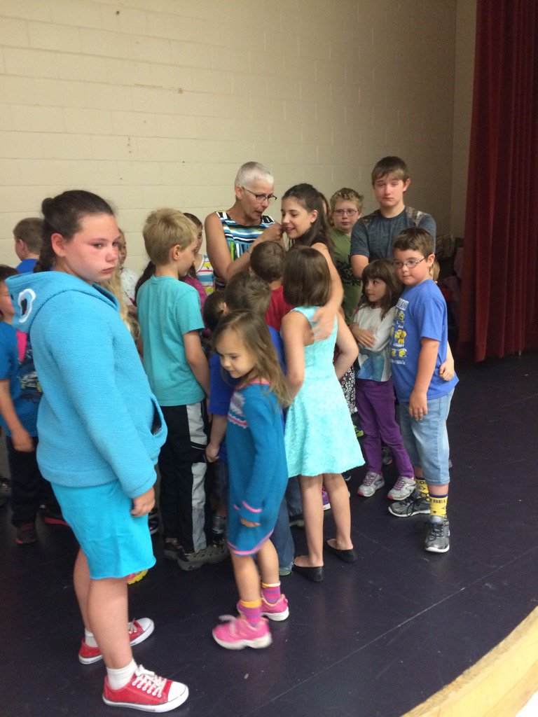 SRFPS1's tweet photo. Students from SRFPS gather for a group hug as they say their good-byes to Madame Demers; who is retiring this year. https://t.co/XjJkcgKm61