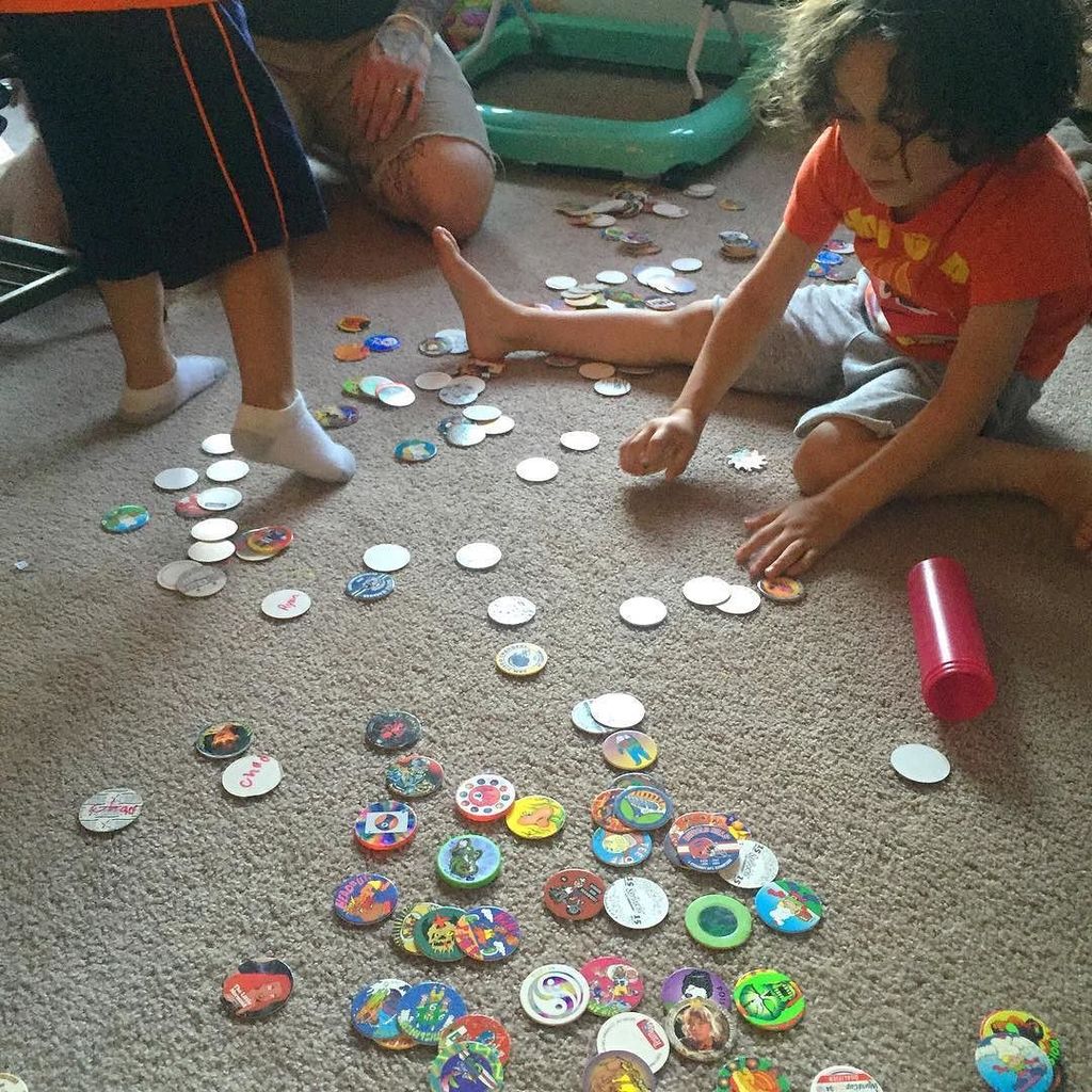 BeardlessKnight's tweet photo. Reliving my youth with my kids. #ilovethe90s #90skid #pogs https://t.co/OEmM3TVL09