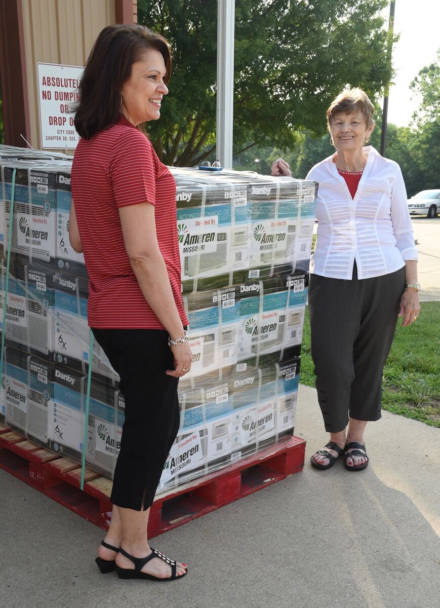 ntjuliesmith's tweet photo. Ameren's Lori Hoelscher, left, poses with the Samaritan Center's Marilyn DeFeo after delivery of 50 window AC units. https://t.co/UjMXutI369