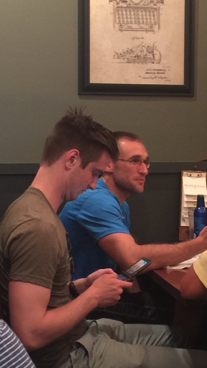 LouFarmTables's tweet photo. Check out this adult playing game boy while at dinner with his friends. This makes me sad. https://t.co/41wr925obd