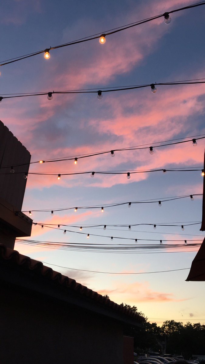 ArielMStein's tweet photo. view from the patio @TrevaRestaurant last night! #pinksky #fairylights #birthdaycelebrations https://t.co/AtHMWvdiL9
