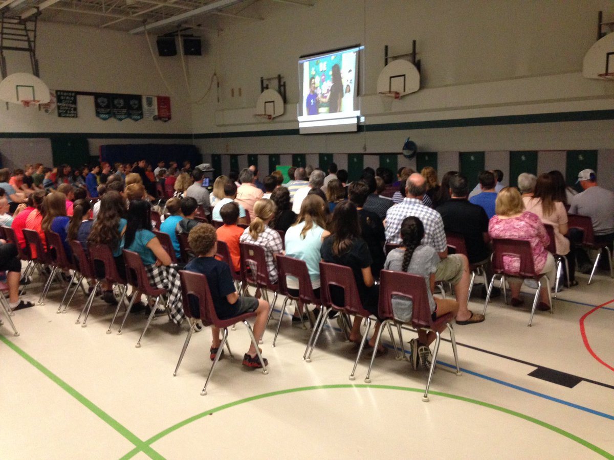 Staff, students and family members come together for the grade 8 award ceremony.