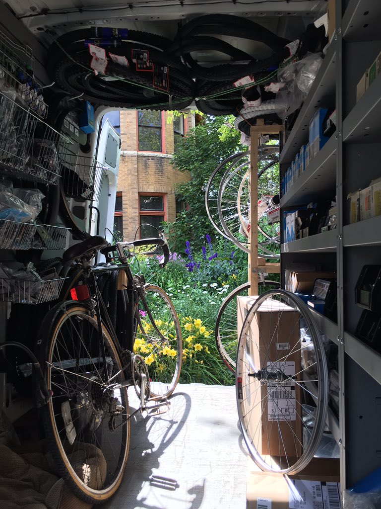 The_BikeMobile's tweet photo. My view out the back door of the shop at the Allen Centennial Garden Final Friday in the Garden event. https://t.co/OhUZe0bxXe