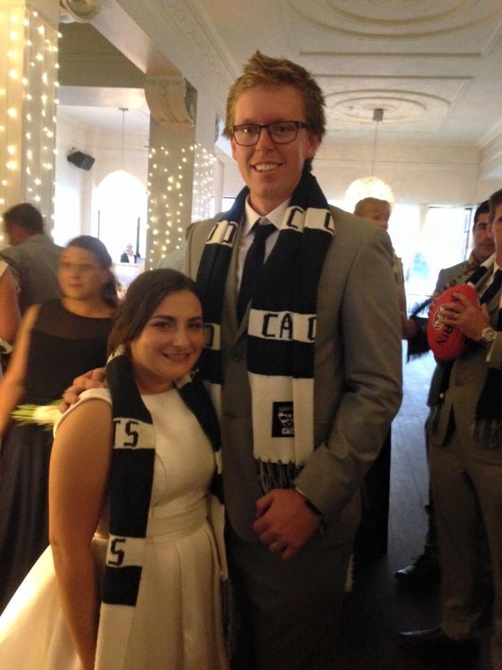 Slattery385's tweet photo. That time we got married and wore @GeelongCats scarfs and ran through a football banner! @GeelongCats https://t.co/7vtJbwDZ4z
