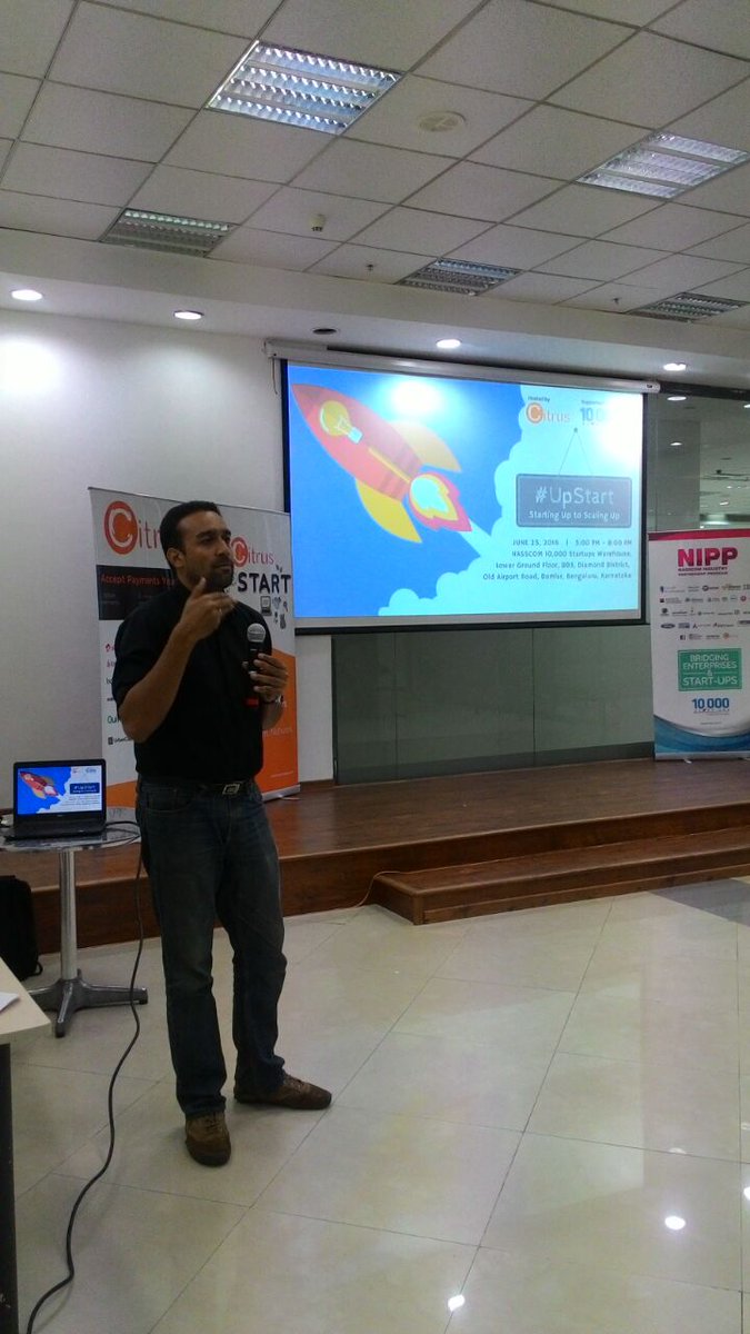 CitrusFlight's tweet photo. #UpStart 4 Rajiv Srivatsa on the stage sharing @UrbanLadder scaling story. Good crowd despite of rain and traffic. https://t.co/qsb4MyC1gN