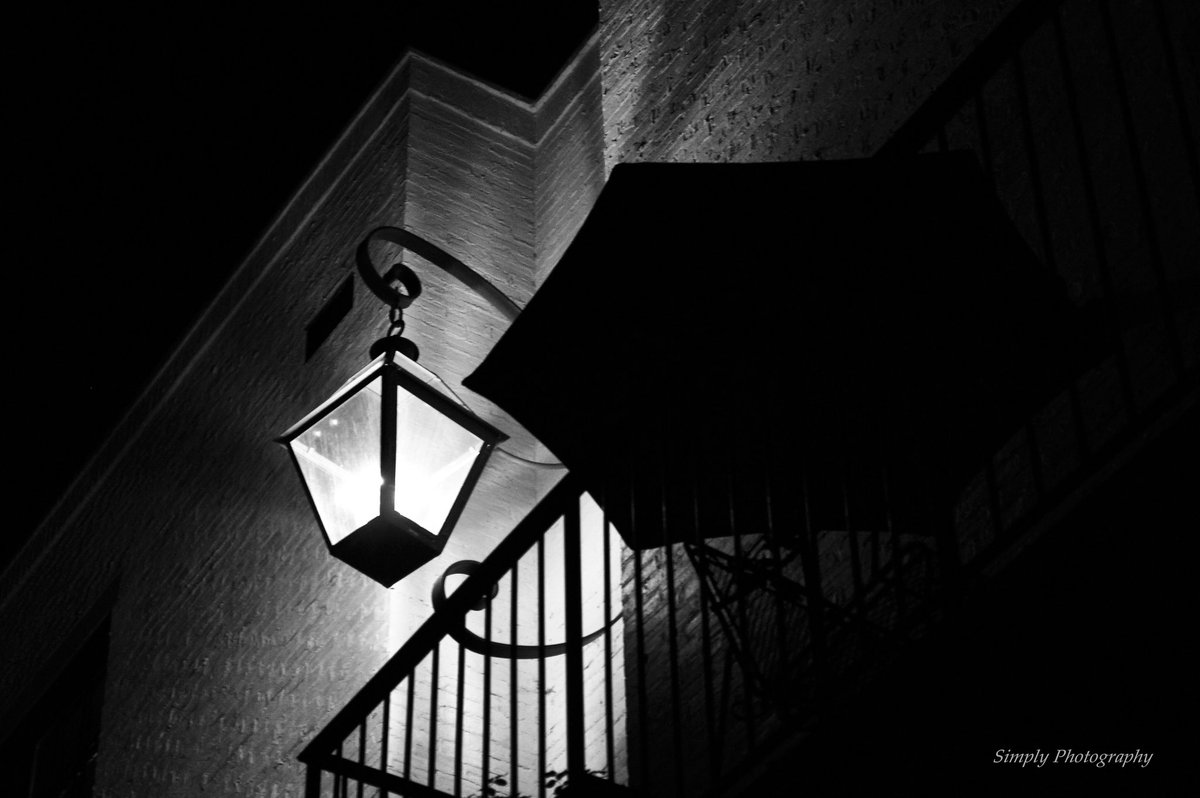 Be the light of someone's world!💡🌍 #photography #photograph #light #lamp #umbrella #building #brick #blackandwhite