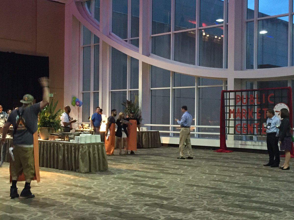 Shell_belle2's tweet photo. Pike Place Market fish throwers at the reception! Solid! #acuhoi https://t.co/3sybyBgNQx
