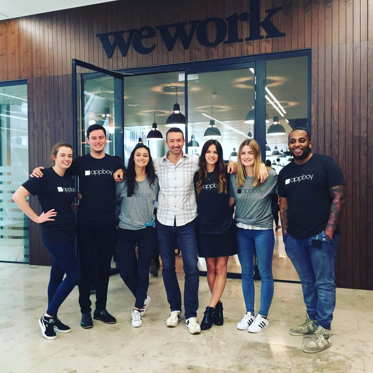 Braze's tweet photo. The #WeWorkMoorgate crew wears Appboy gear today.  Thanks for giving our EMEA team such a great space, @WeWorkLDN! https://t.co/YzpPoTMWOd