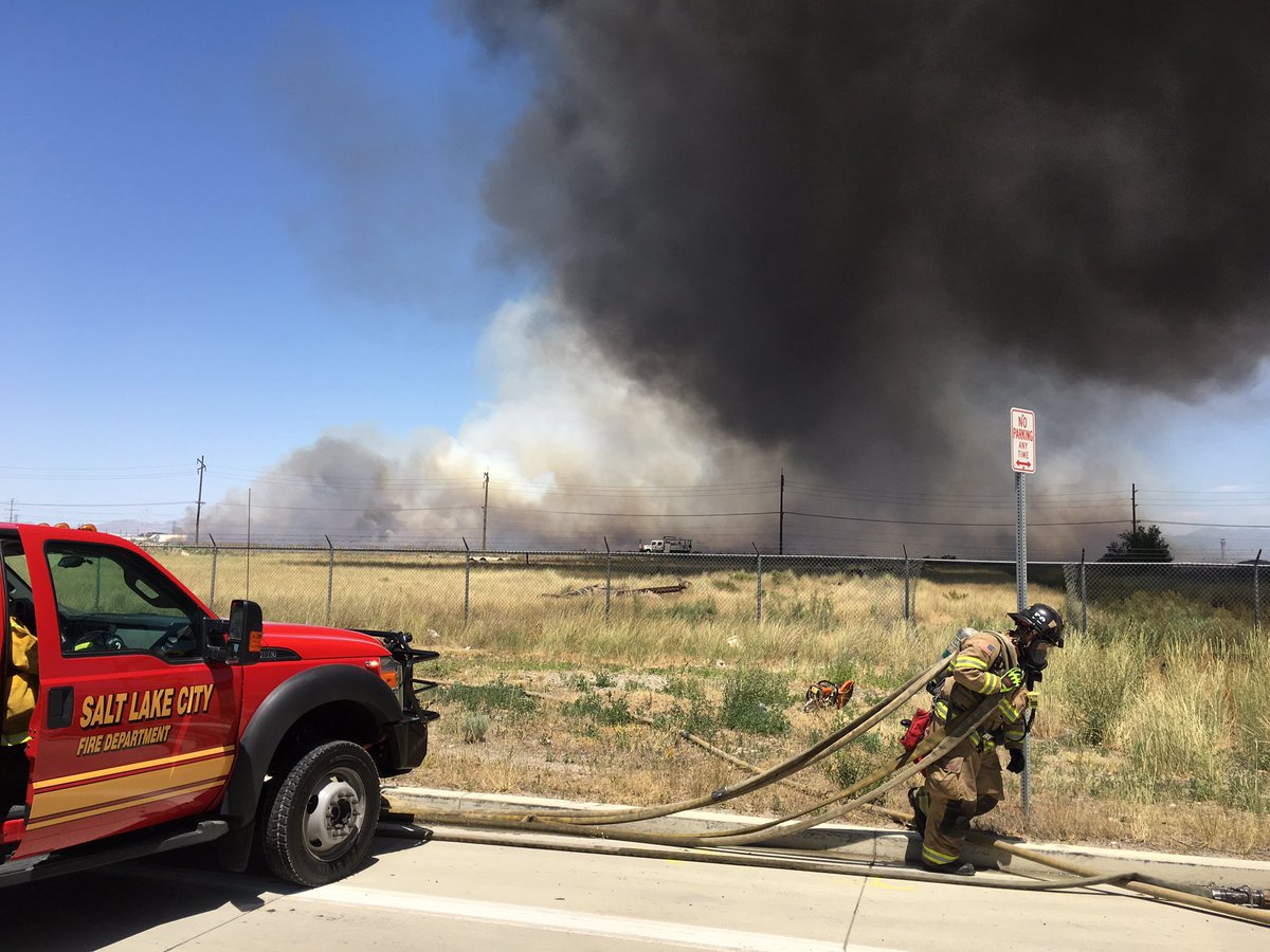 slcfire's tweet photo. Flames jump 700 S, sparked large grass fire moving toward I80. Avoid smoke &amp; slow on I80 if visibility is reduced. https://t.co/o9kwRF5Uiu
