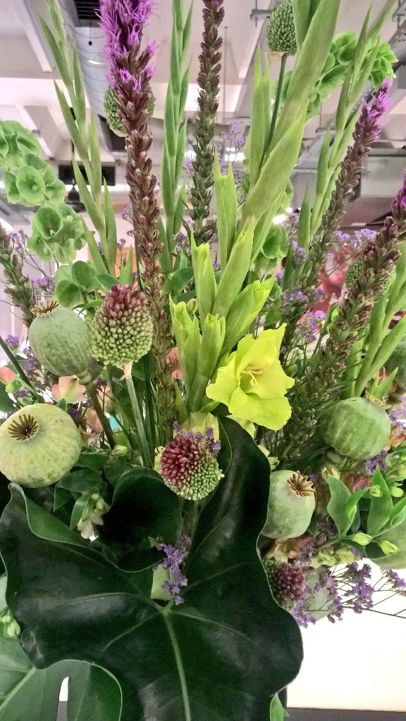 A summer arrangement with lots.of interesting ingredients. poppy pods, gladiolus, Irish bells.